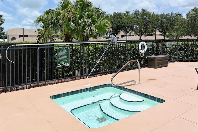 view of pool featuring a hot tub