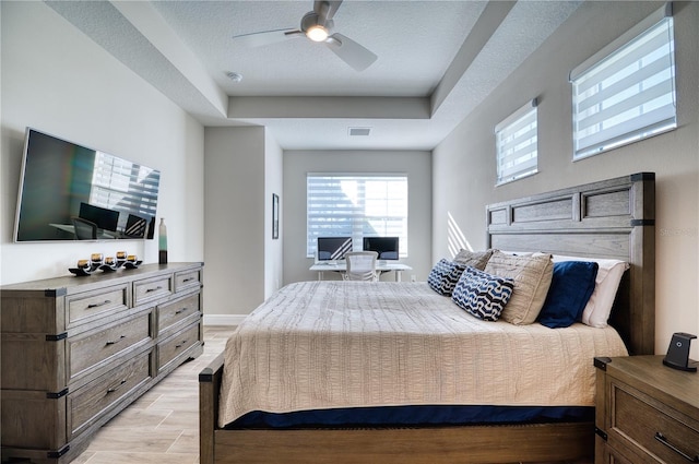 bedroom featuring a textured ceiling and ceiling fan