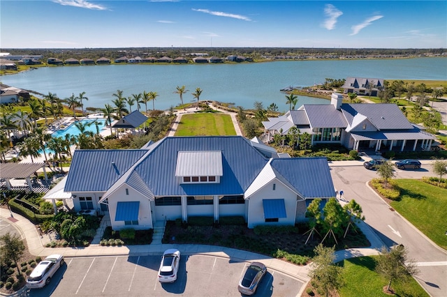 birds eye view of property with a water view