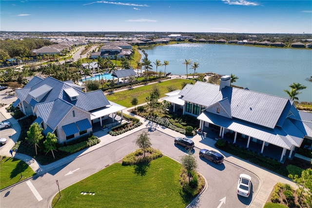 birds eye view of property with a water view