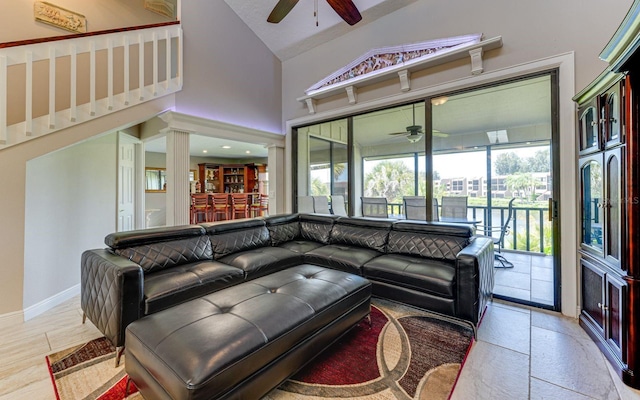 living room featuring ceiling fan and lofted ceiling