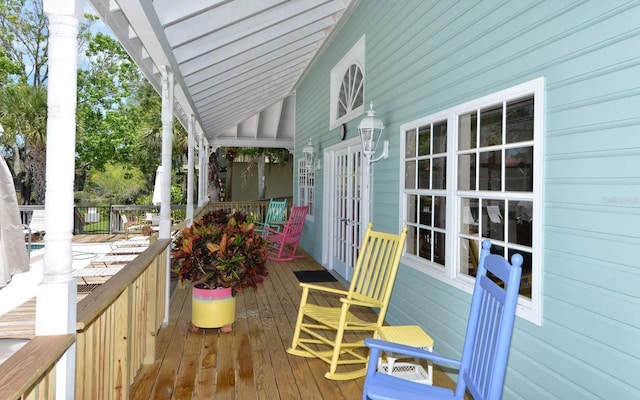 wooden terrace with a porch