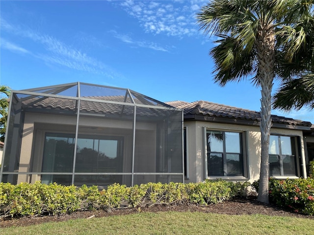 view of home's exterior with a lanai