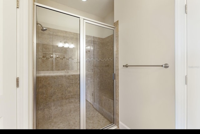 bathroom with a shower with shower door