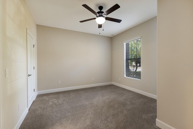 spare room featuring ceiling fan and carpet