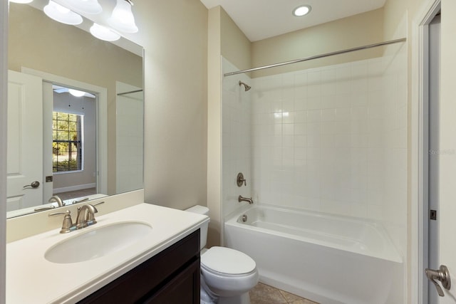 full bathroom with bathing tub / shower combination, tile patterned floors, vanity, and toilet