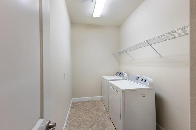 washroom with separate washer and dryer