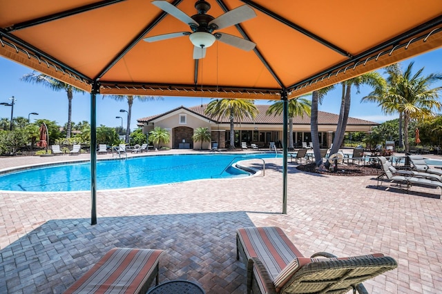 view of pool with a gazebo, a patio area, and ceiling fan