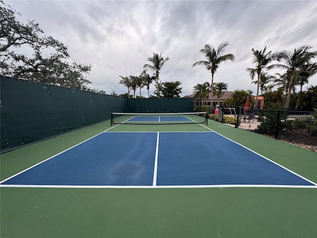 view of tennis court featuring basketball court