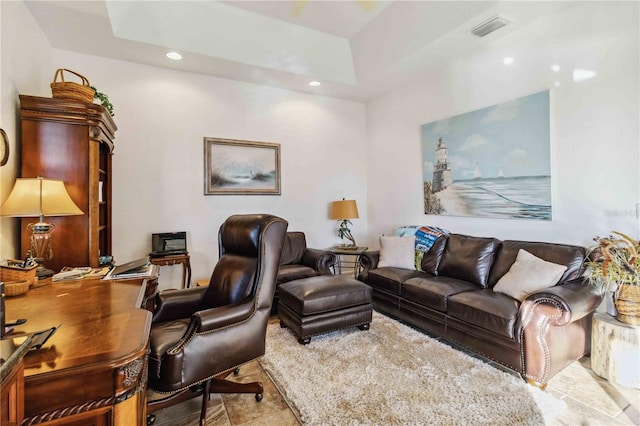 living room with a raised ceiling