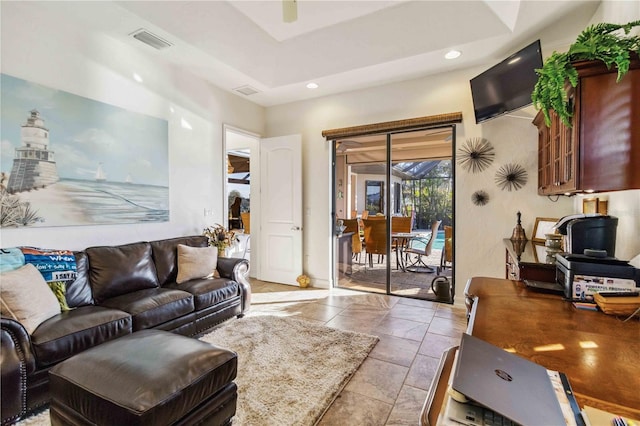 living room featuring a tray ceiling