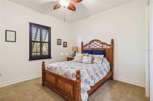 bedroom with light carpet and ceiling fan