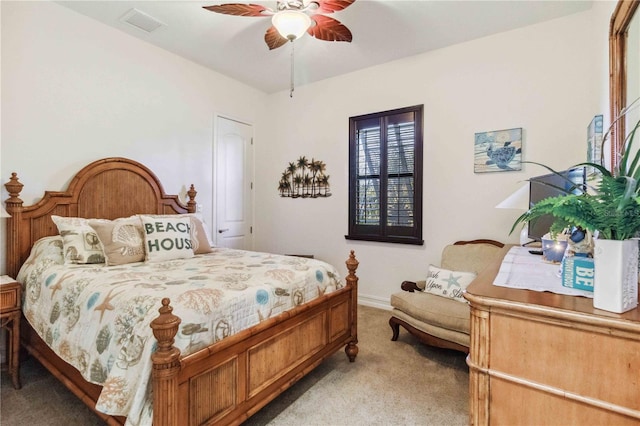 carpeted bedroom with ceiling fan and a closet