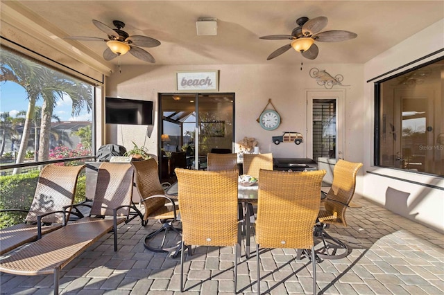 sunroom / solarium with ceiling fan