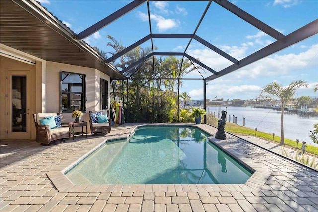 view of swimming pool with a patio, a water view, an outdoor hangout area, and glass enclosure