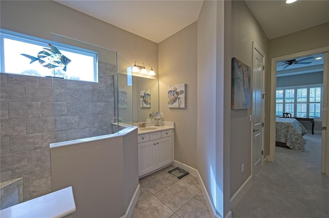 bathroom with a shower, vanity, tile patterned floors, and ceiling fan