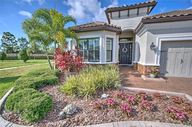 doorway to property featuring a lawn