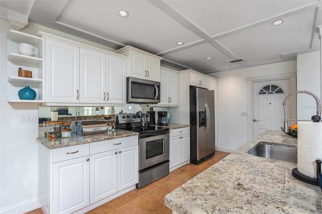 kitchen featuring light stone countertops, white cabinetry, sink, and appliances with stainless steel finishes