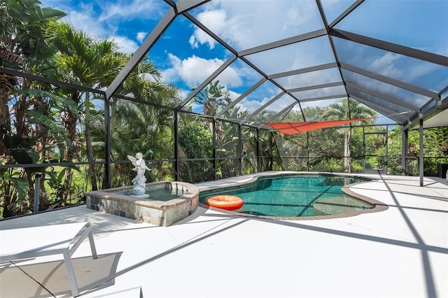 view of pool featuring an in ground hot tub, a lanai, and a patio area