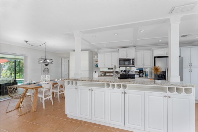 kitchen with white cabinetry, stainless steel appliances, decorative light fixtures, a center island with sink, and light tile patterned flooring