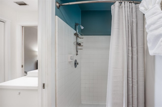 bathroom with a shower with shower curtain