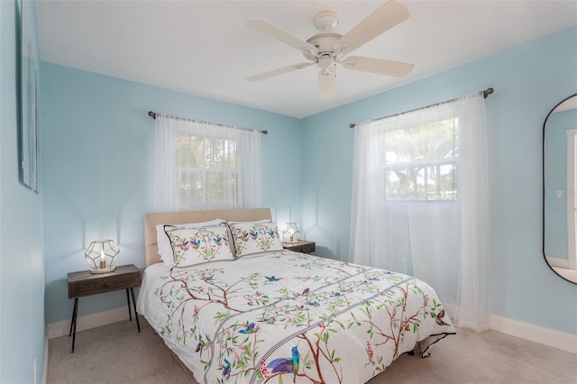 bedroom featuring ceiling fan and light colored carpet