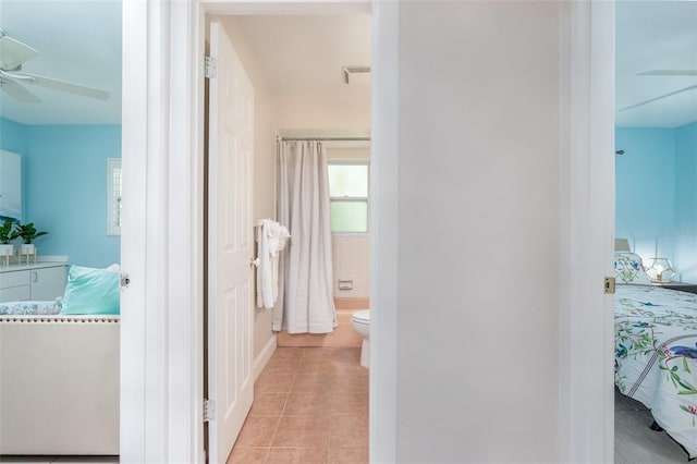 hall with light tile patterned floors