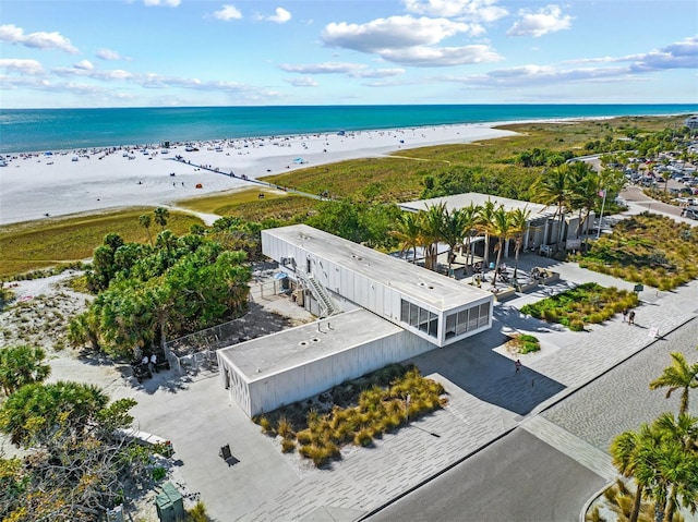 birds eye view of property featuring a view of the beach and a water view