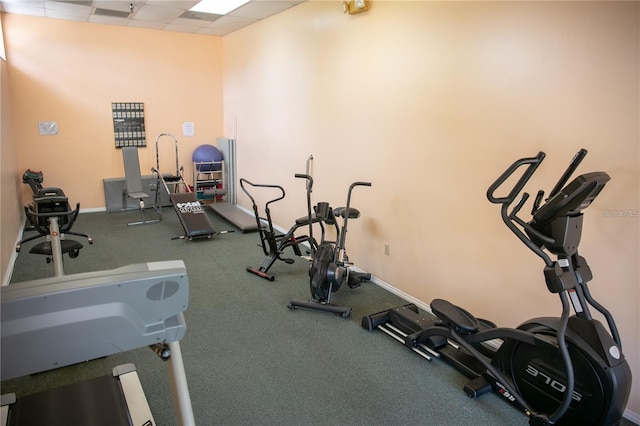 workout area with a paneled ceiling