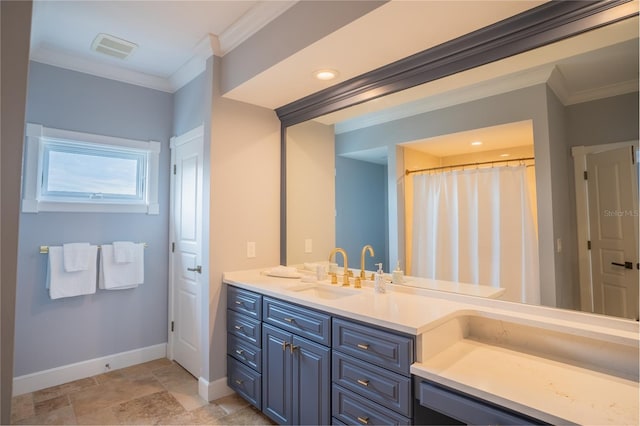 bathroom with crown molding and vanity