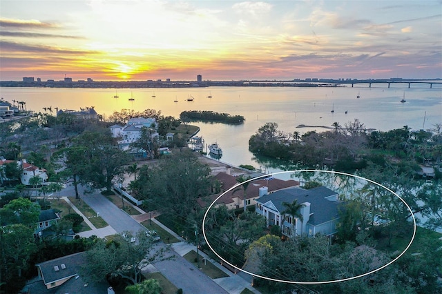 aerial view at dusk with a water view