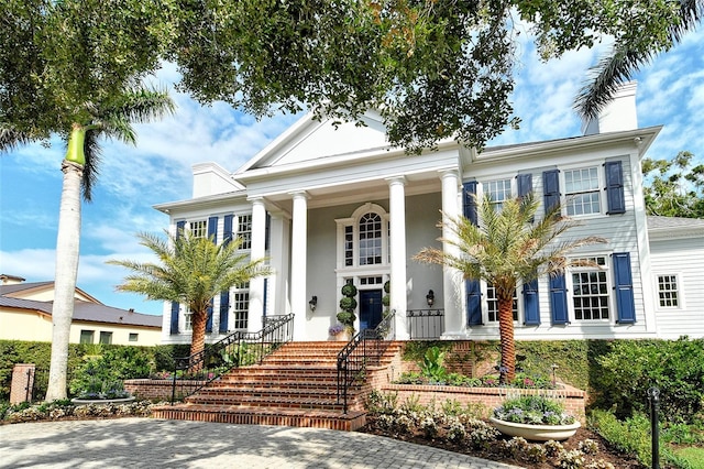 1541 Bay Point Dr, Sarasota, FL 34236 - greek revival inspired property featuring a chimney and covered porch