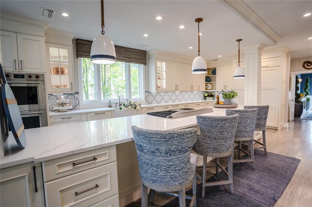 1541 Bay Point Dr, Sarasota, FL 34236 - kitchen featuring decorative backsplash, open shelves, appliances with stainless steel finishes, light wood finished floors, and recessed lighting