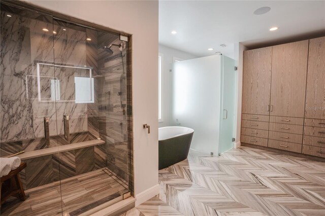 1541 Bay Point Dr, Sarasota, FL 34236 - bathroom featuring a shower stall, a soaking tub, and recessed lighting