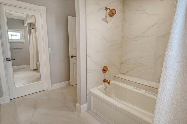 1541 Bay Point Dr, Sarasota, FL 34236 - full bath with marble look tiles, baseboards, and shower / tub combo with curtain