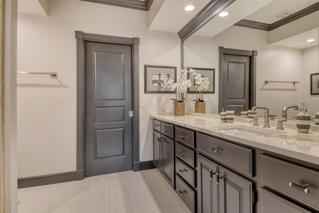 1541 Bay Point Dr, Sarasota, FL 34236 - bathroom with vanity, baseboards, crown molding, and recessed lighting