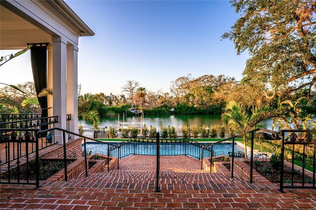 1541 Bay Point Dr, Sarasota, FL 34236 - view of pool with a water view and a patio area