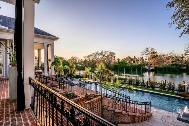 1541 Bay Point Dr, Sarasota, FL 34236 - balcony at dusk with a water view