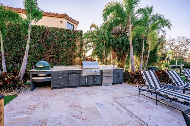1541 Bay Point Dr, Sarasota, FL 34236 - view of patio / terrace with an outdoor kitchen and a grill