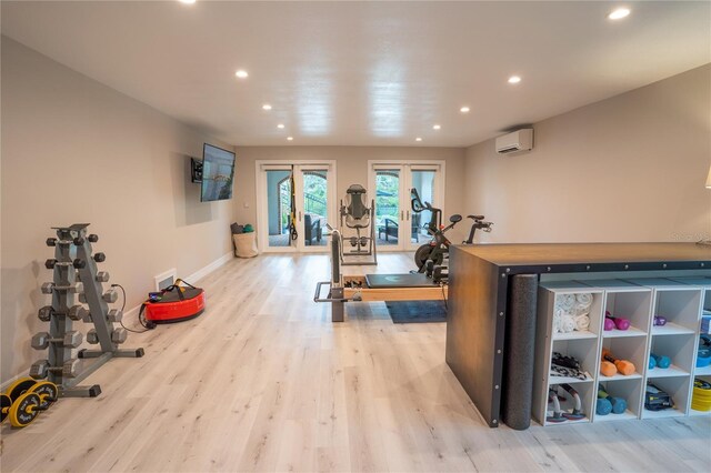 1541 Bay Point Dr, Sarasota, FL 34236 - exercise area featuring a wall mounted air conditioner, recessed lighting, wood finished floors, french doors, and baseboards