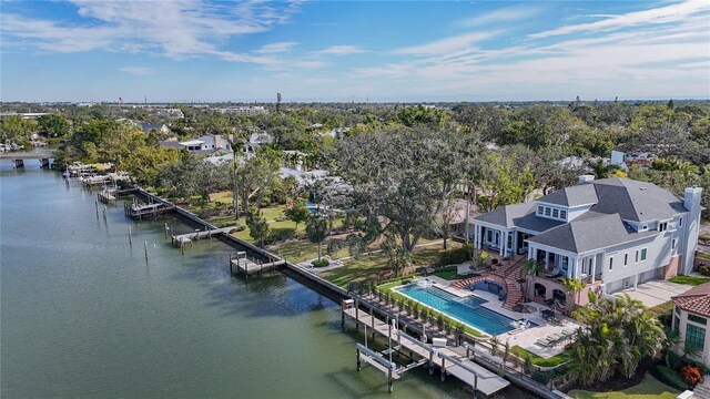 1541 Bay Point Dr, Sarasota, FL 34236 - aerial view of a nearby body of water, a tree filled landscape, and a pool area