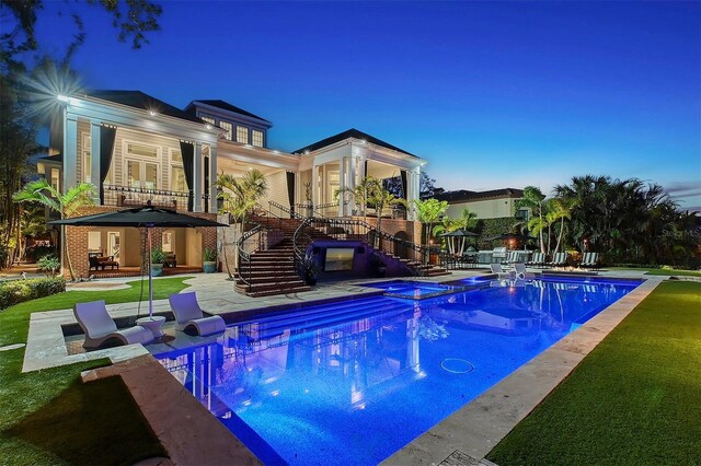 1541 Bay Point Dr, Sarasota, FL 34236 - view of pool featuring stairs, a patio area, and a pool with connected hot tub