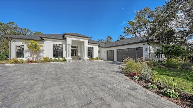 prairie-style home featuring a garage