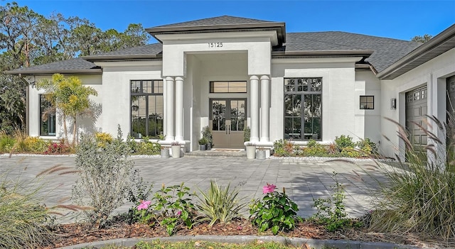 entrance to property featuring french doors