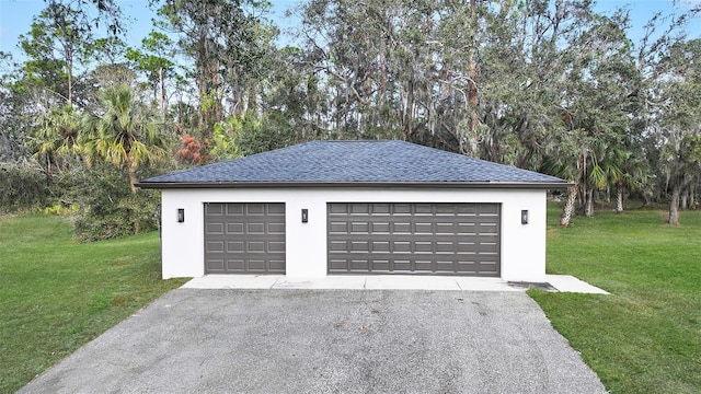 garage featuring a lawn