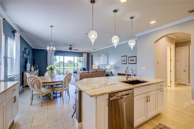 kitchen featuring white cabinets, dishwasher, sink, a kitchen island with sink, and ceiling fan