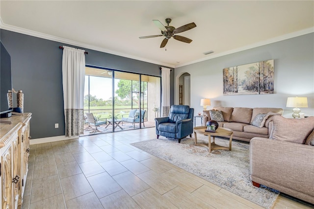 living room with ceiling fan and crown molding