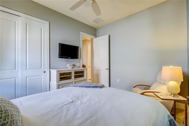 bedroom featuring ceiling fan and a closet