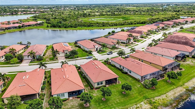 drone / aerial view with a water view