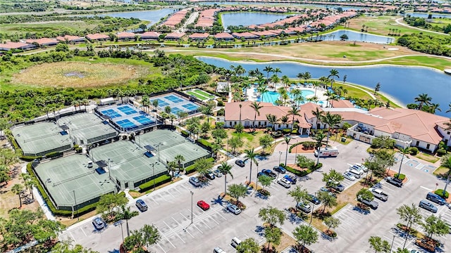 birds eye view of property with a water view